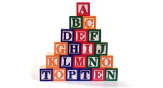 wooden alphabet blocks stacked like a pyramid