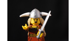Lego figure of an opera singer second pose as though singing an aria